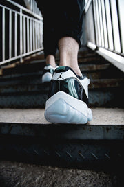 Air Jordan 11 Iridescent Sneakers in White and Black