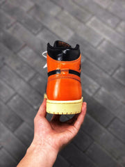 Air Jordan 1 Retro High OG Black and Orange Sneakers